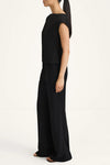 Woman wearing a black outfit on a white background