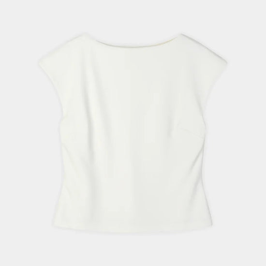 An off-white short-sleeve top with a wide boat neckline, shown from the back against a light gray background.