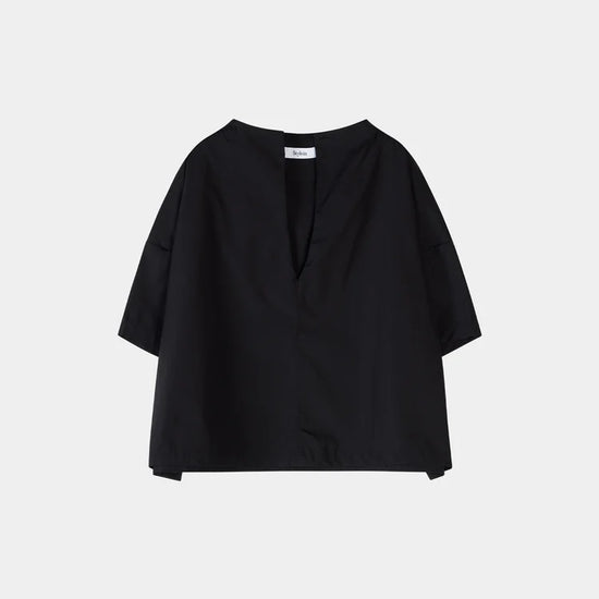 Black blouse on a light gray background