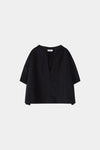 Black blouse on a light gray background