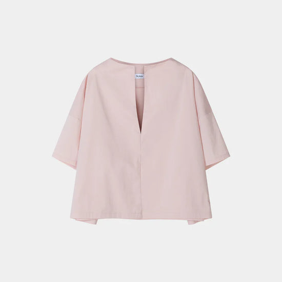 Pink blouse with a V-neckline on a white background