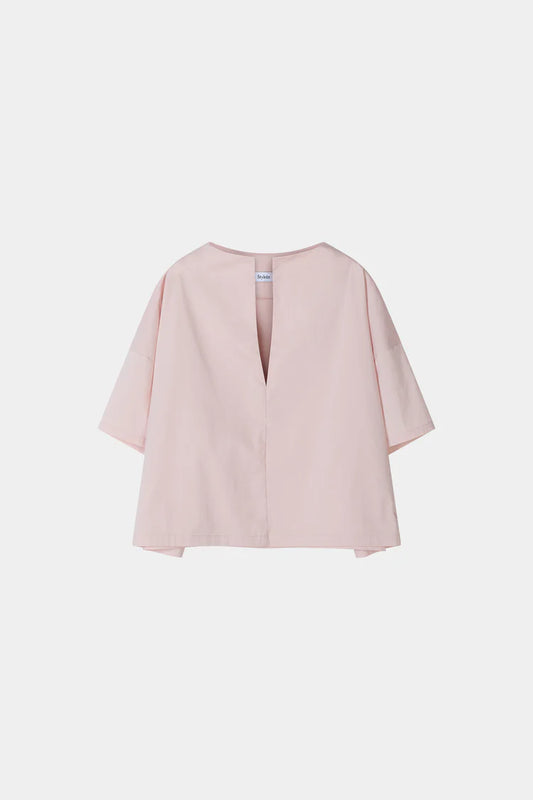 Pink blouse with a V-neckline on a white background