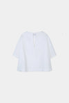 White blouse on a light beige background from Stylein