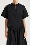 Black top and skirt set on a plain background from Stylein