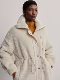 Off-white midi faux fur coat with high collar gold metallic hardware full length zip and pull in waist with popper and pocket details