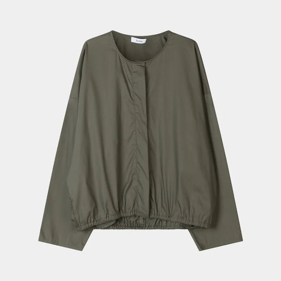 grey blouse on a white background 