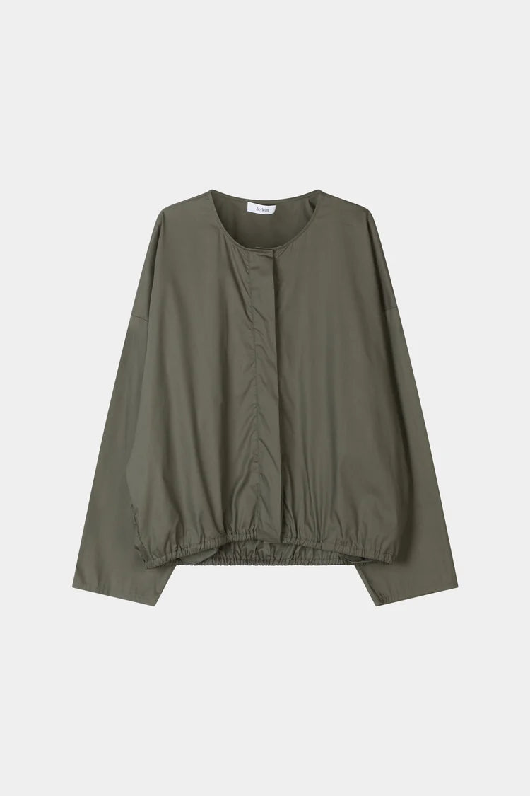 grey blouse on a white background 