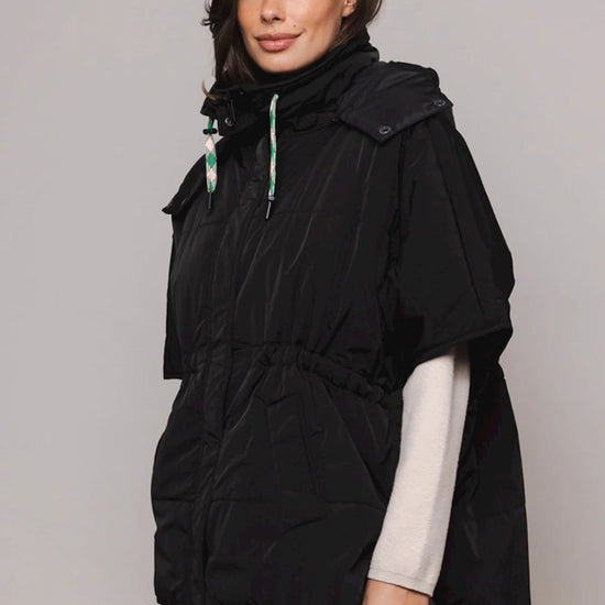 Black shower proof cape with detachable hood and drawstring fastenings sleeveless with two front slant pockets