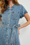 Denim dress with a belt on a plain background