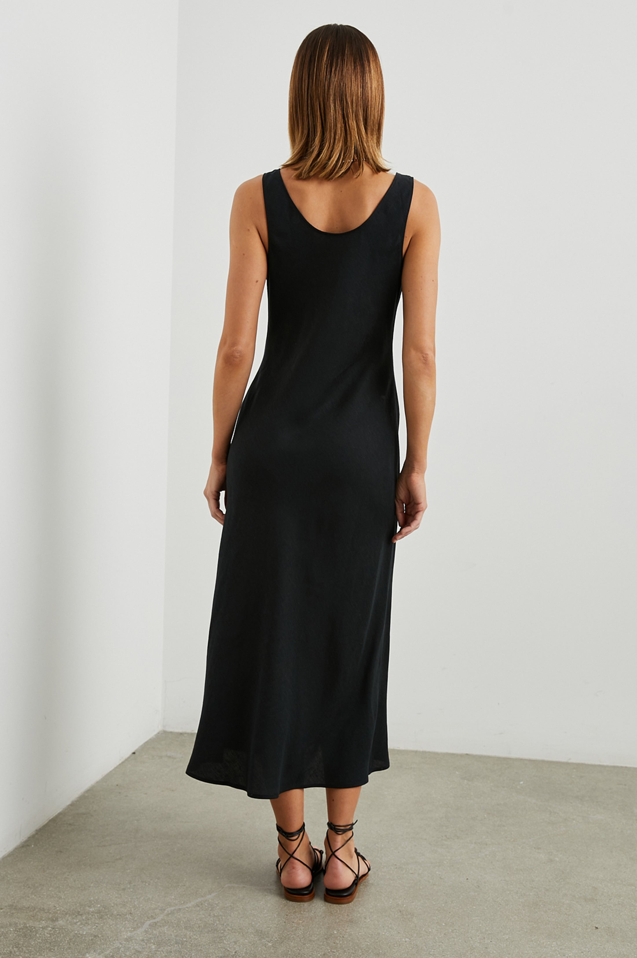 Black sleeveless dress with side split rear view