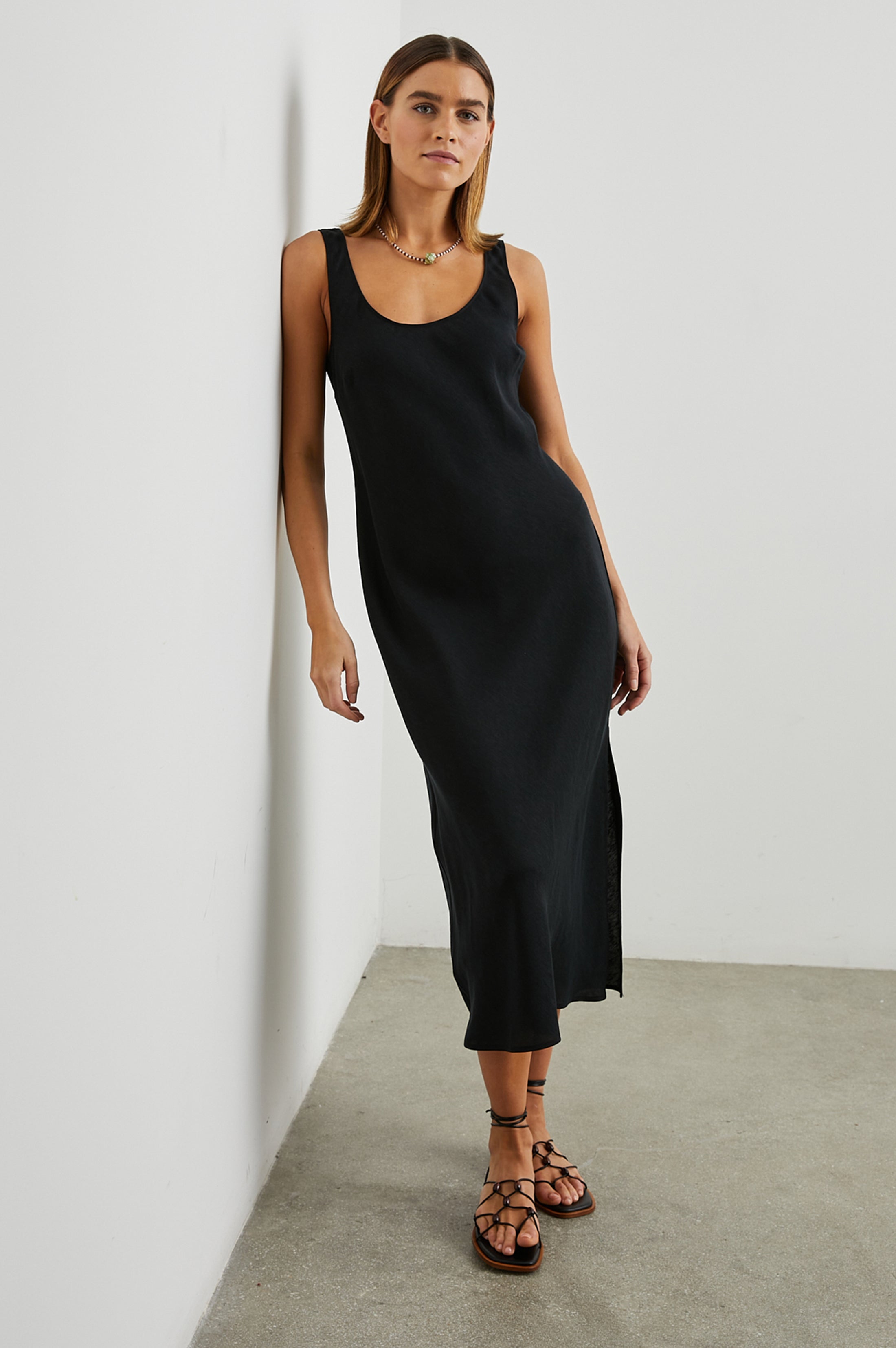 Black sleeveless dress with side split