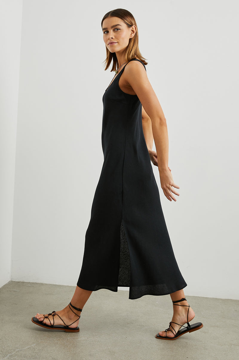 Black sleeveless dress with side split side view