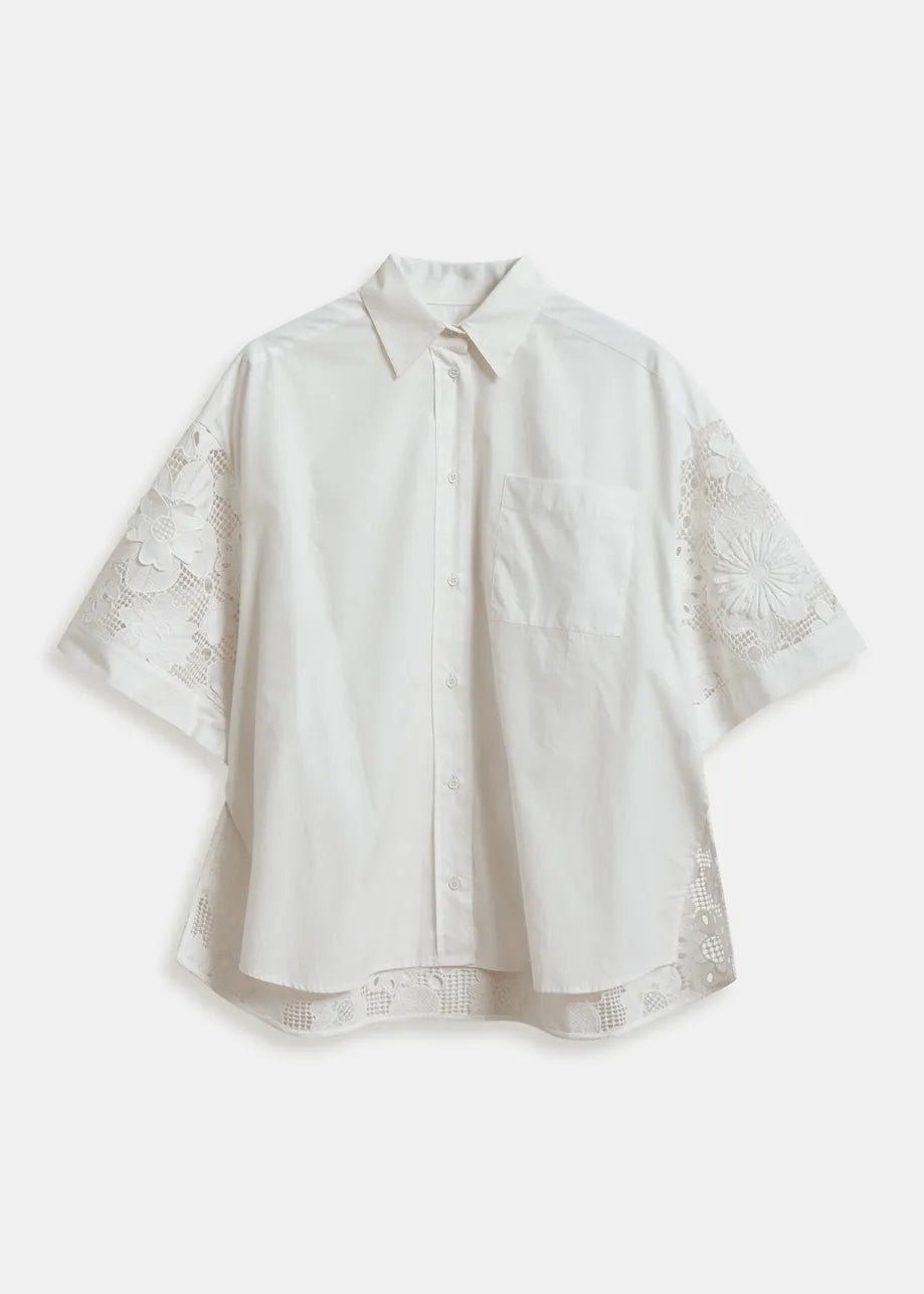 White blouse with lace sleeves on a white background