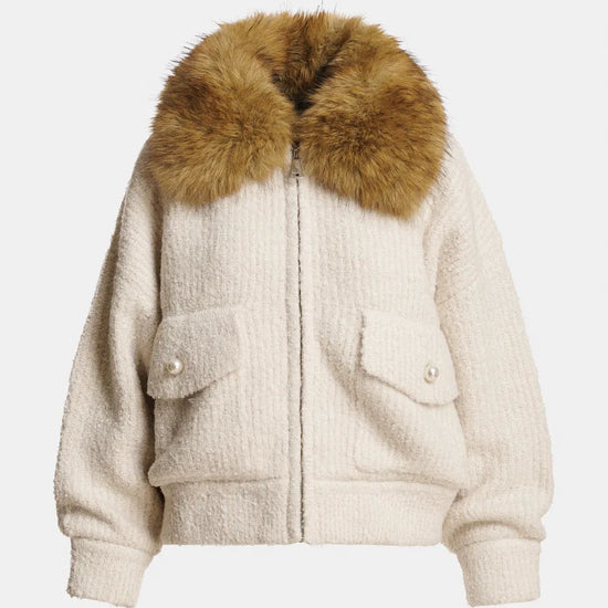 Beige jacket with a fur collar on a light gray background