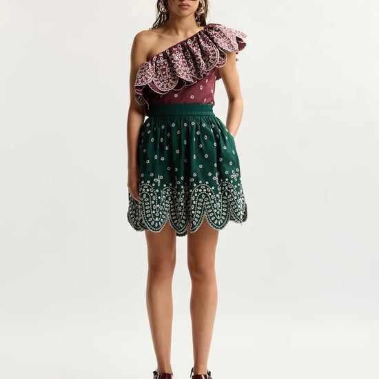 model wearing green skirt