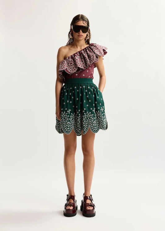 model wearing green skirt