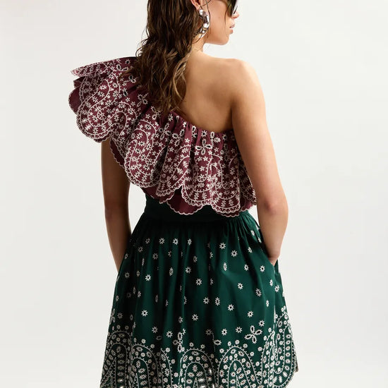 rear of model wearing green skirt 