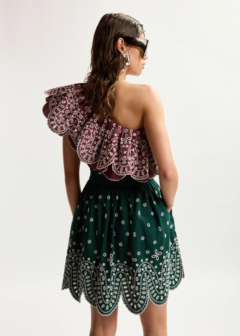 rear of model wearing green skirt 