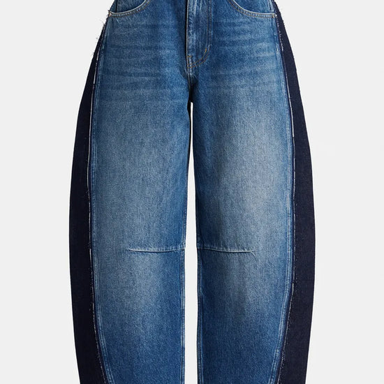 A pair of wide-leg blue denim jeans with contrasting dark navy side panels, shown against a plain light gray background.