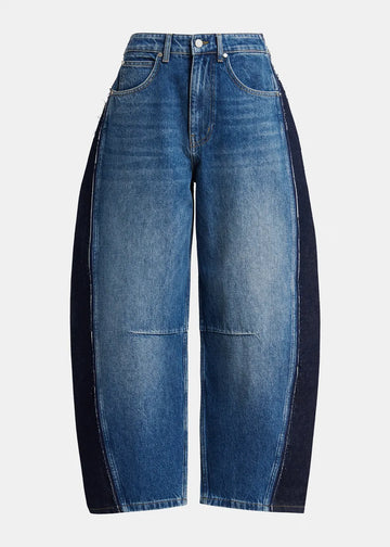 A pair of wide-leg blue denim jeans with contrasting dark navy side panels, shown against a plain light gray background.