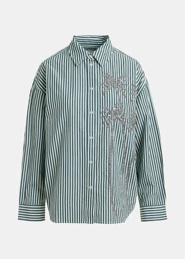 Green and white striped shirt with floral embroidery on a light gray background