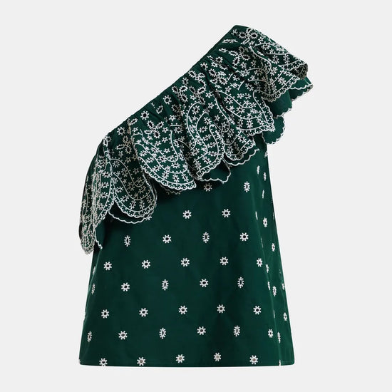 Green one-shoulder dress with white floral pattern on a light gray background