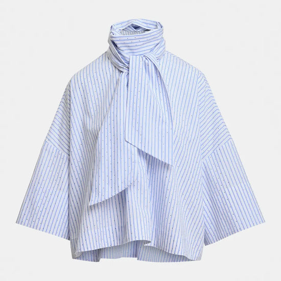 A light blue and white striped blouse with a high gathered mock neck, a large front bow, and wide draped sleeves, shown against a plain light gray background.