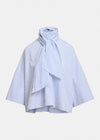 A light blue and white striped blouse with a high gathered mock neck, a large front bow, and wide draped sleeves, shown against a plain light gray background.