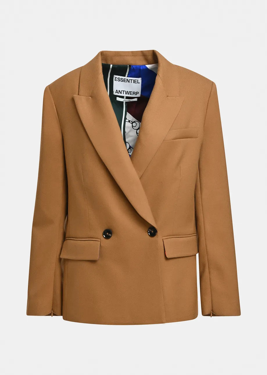 A camel brown double-breasted blazer with notched lapels and flap pockets, shown flat against a light gray background. The inner collar label shows the brand 'Essentiel Antwerp'.