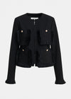 A black cropped jacket with fringed trim details and gold-tone button accents, shown against a plain light gray background.