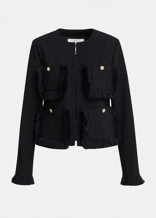A black cropped jacket with fringed trim details and gold-tone button accents, shown against a plain light gray background.