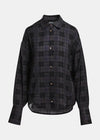 A dark charcoal gray and black plaid button-down shirt with brown buttons, displayed on a clean light gray background.