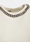 White tshirt with a chain close up