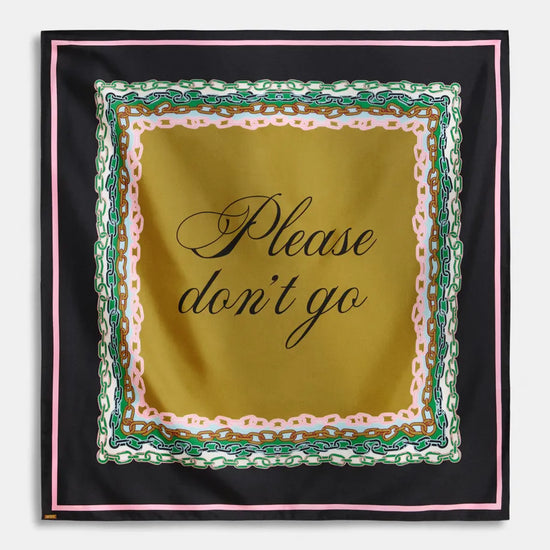 A square silk scarf with a black border, featuring a central gold panel with the phrase 'Please don't go' in black script, surrounded by a decorative border of pink, green, and white chain-link motifs.