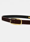 A dark brown leather belt with a polished gold-tone metal buckle, shown coiled on a light gray background.