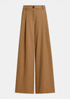 A pair of wide-leg trousers in a warm camel brown color, shown flat against a light gray background.