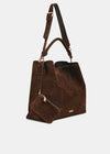 A dark brown suede tote bag with a matching zippered pouch and a shoulder strap, shown against a light gray background.