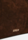 Close-up of a dark brown suede or faux-suede material surface with the white 'ESSENTIEL ANTWERP' logo printed near the bottom.