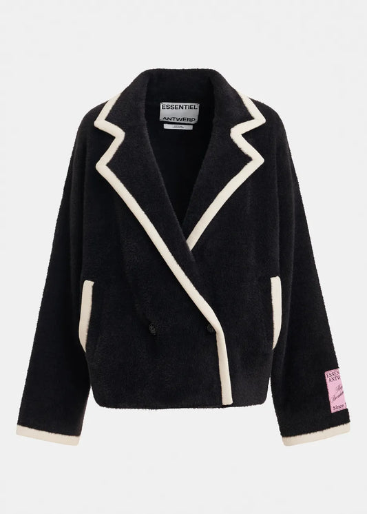 A black sherpa fleece wrap jacket with cream-colored contrast piping and trim, featuring a pointed lapel design, front pockets, and a pink 'ESSENTIALS AUTHENTIC' patch on the left sleeve cuff, shown against a light gray background.