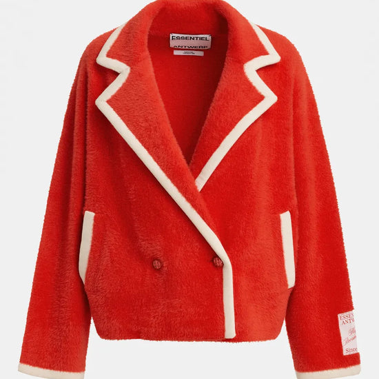 A bright red sherpa fleece blazer jacket with contrasting cream-colored piping and trim, shown against a plain light gray background. The brand 'ESSENTIALS' is visible on the inner neck label.