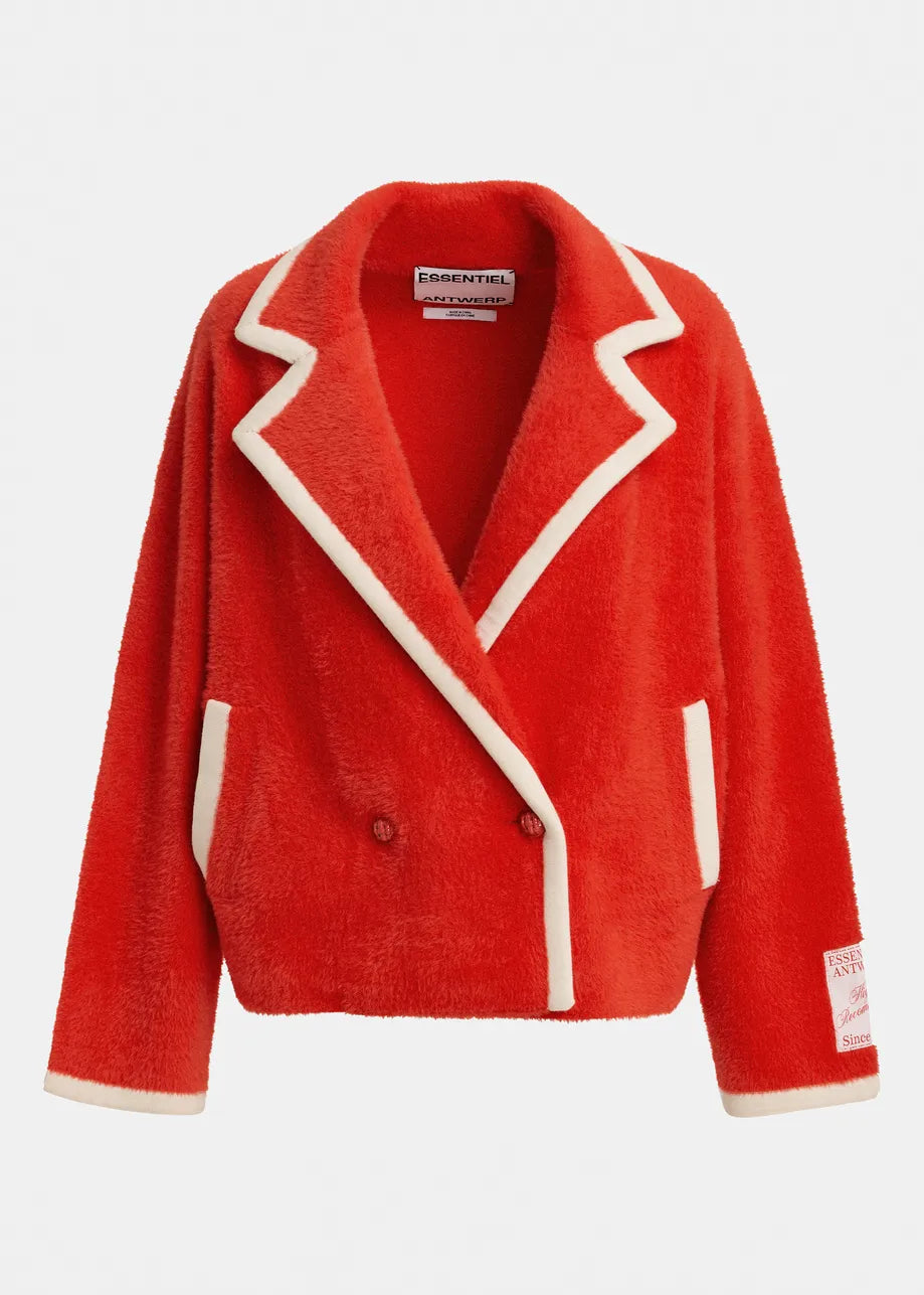A bright red sherpa fleece blazer jacket with contrasting cream-colored piping and trim, shown against a plain light gray background. The brand 'ESSENTIALS' is visible on the inner neck label.