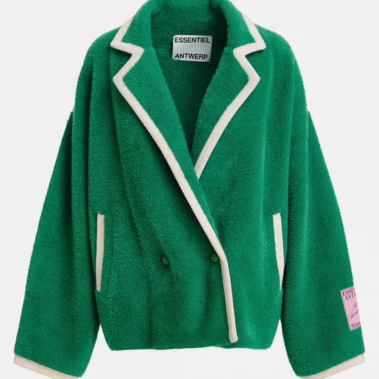A green plush fleece blazer jacket with cream-colored piping and trim, featuring a collar, front buttons, and a pink brand patch on the sleeve, shown against a light gray background.