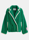 A green plush fleece blazer jacket with cream-colored piping and trim, featuring a collar, front buttons, and a pink brand patch on the sleeve, shown against a light gray background.