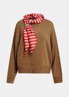 A camel brown knit sweater with a red and white striped silk scarf tied around the collar, displayed on a clean white background.
