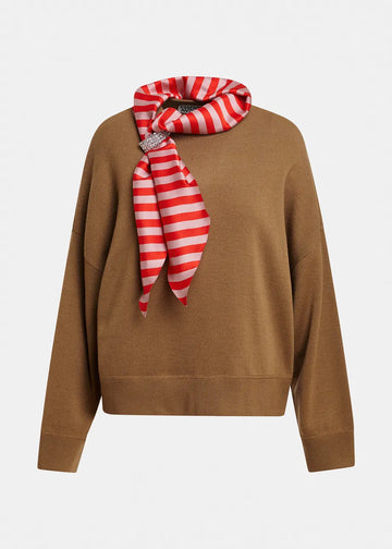 A camel brown knit sweater with a red and white striped silk scarf tied around the collar, displayed on a clean white background.