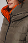 khaki long padded reversible coat with hood and orange interior close up