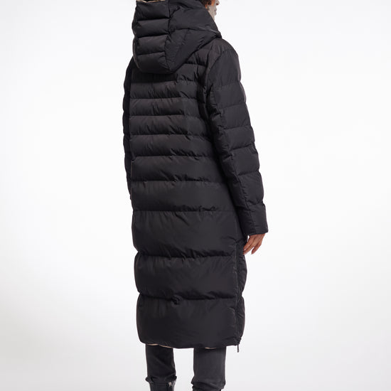 reversible black mid length padded coat with a brown interior, high neck and collar rear view 