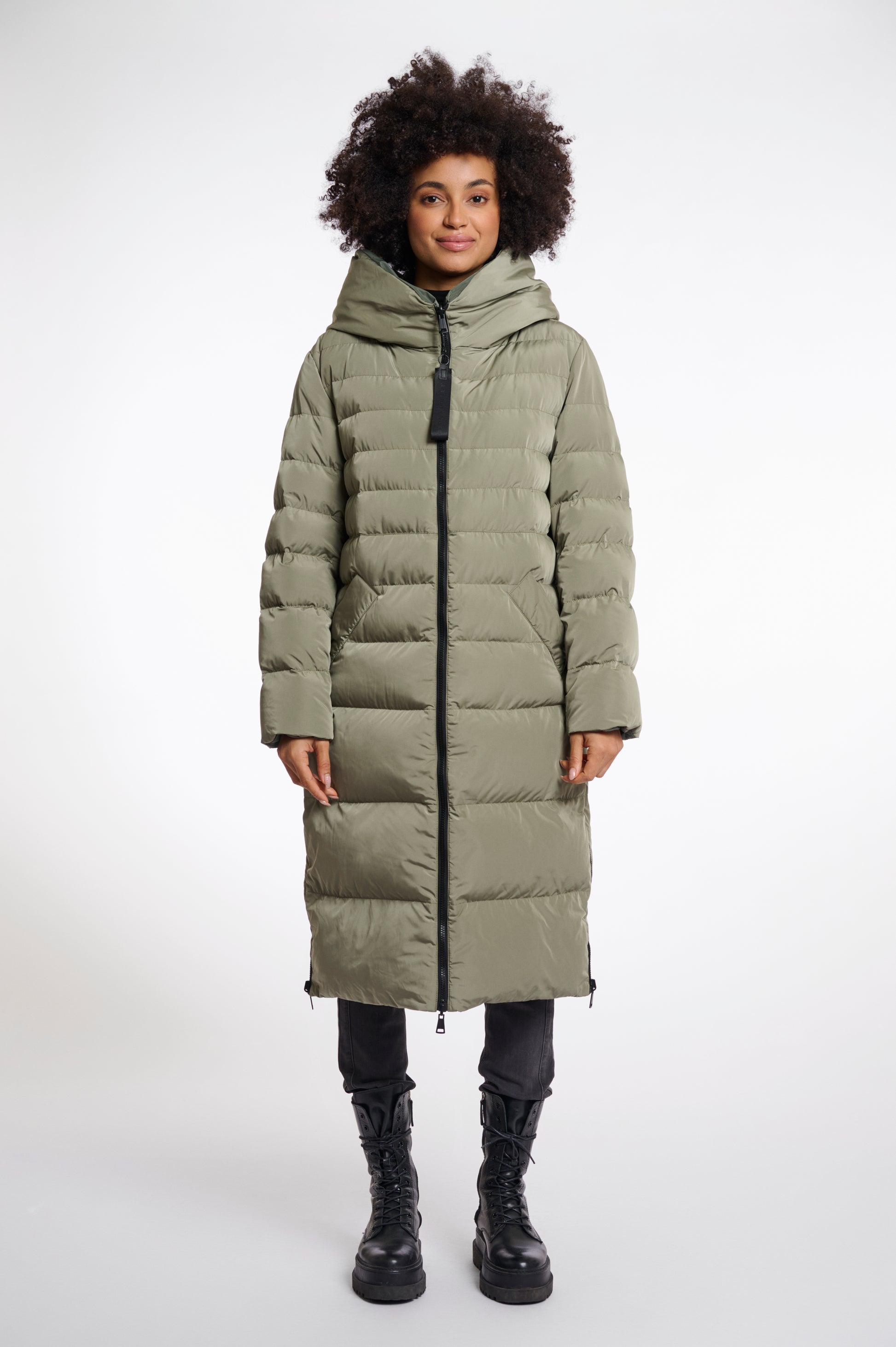 green mid length added reversible coat with matt green exterior, large hod and side pockets 