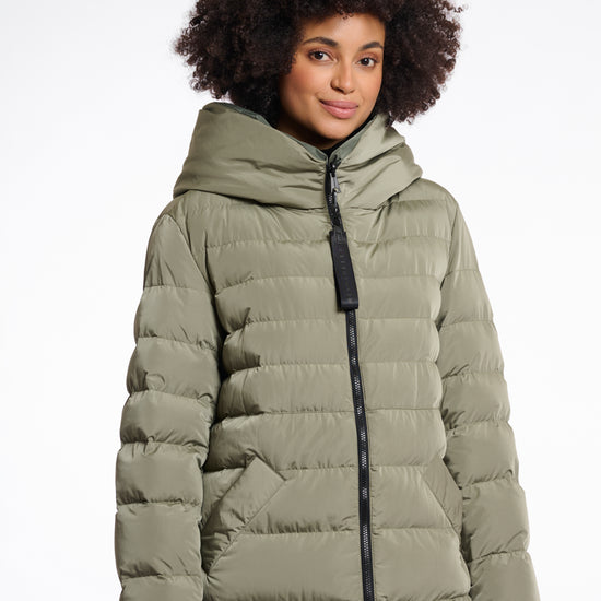 green mid length added reversible coat with matt green exterior, large hod and side pockets close up