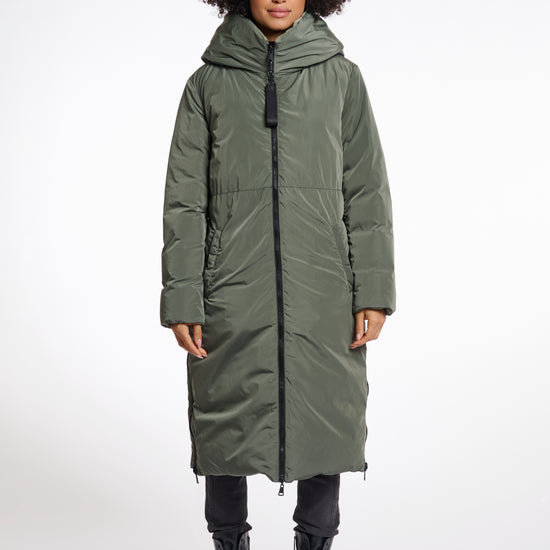 green mid length added reversible coat with matt green exterior, large hod and side pockets interior shot